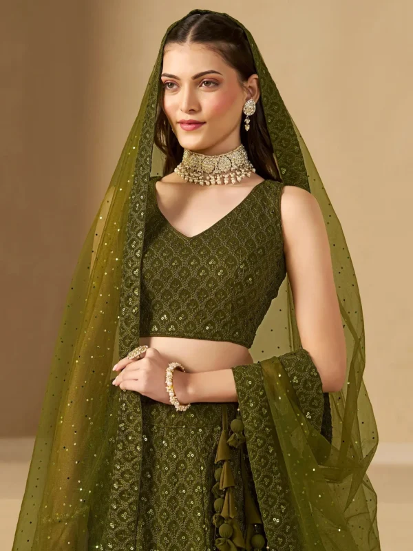 🫒 Rich Olive Green Georgette Body — sophisticated, earthy & universally flattering 🧵 Delicate Thread Embroidery — intricate handcraft detailing across the full lehenga ✨ Sequin Work Throughout — soft shimmer that glows beautifully in evening light 👘 Matching Georgette Choli — fully embroidered for a seamless head-to-toe look 🧣 Soft Net Dupatta — sequin accents and lace borders on all sides for ethereal finish 📐 Semi-Stitched up to 42 inches — fits most sizes comfortably ✂️ Unstitched Choli Material — stitch to your exact measurements for perfect fit 📦 Custom Size Available — XS, S, M, L, XL or fully custom 🏪 Pickup Available — ready in 24 hours from store ✅ Perfect For — receptions, evening functions, weddings, sangeet, festive occasions