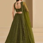 🫒 Rich Olive Green Georgette Body — sophisticated, earthy & universally flattering 🧵 Delicate Thread Embroidery — intricate handcraft detailing across the full lehenga ✨ Sequin Work Throughout — soft shimmer that glows beautifully in evening light 👘 Matching Georgette Choli — fully embroidered for a seamless head-to-toe look 🧣 Soft Net Dupatta — sequin accents and lace borders on all sides for ethereal finish 📐 Semi-Stitched up to 42 inches — fits most sizes comfortably ✂️ Unstitched Choli Material — stitch to your exact measurements for perfect fit 📦 Custom Size Available — XS, S, M, L, XL or fully custom 🏪 Pickup Available — ready in 24 hours from store ✅ Perfect For — receptions, evening functions, weddings, sangeet, festive occasions
