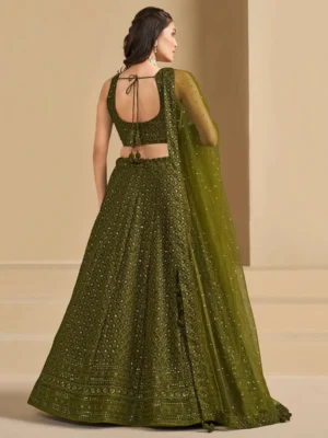🫒 Rich Olive Green Georgette Body — sophisticated, earthy & universally flattering 🧵 Delicate Thread Embroidery — intricate handcraft detailing across the full lehenga ✨ Sequin Work Throughout — soft shimmer that glows beautifully in evening light 👘 Matching Georgette Choli — fully embroidered for a seamless head-to-toe look 🧣 Soft Net Dupatta — sequin accents and lace borders on all sides for ethereal finish 📐 Semi-Stitched up to 42 inches — fits most sizes comfortably ✂️ Unstitched Choli Material — stitch to your exact measurements for perfect fit 📦 Custom Size Available — XS, S, M, L, XL or fully custom 🏪 Pickup Available — ready in 24 hours from store ✅ Perfect For — receptions, evening functions, weddings, sangeet, festive occasions